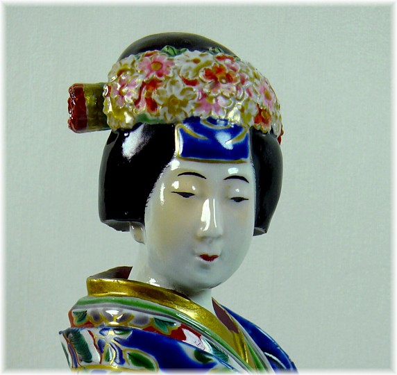 Japanese antique porcelain figurine od a woman with small drum in her hand, 1850's