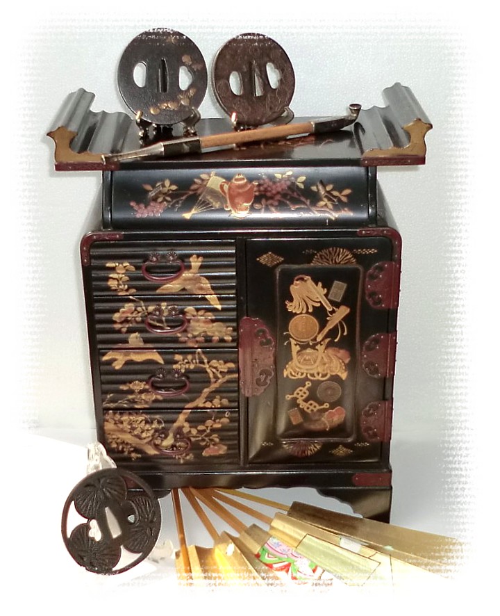 japanese collectibles: wooden cabinet, antique smoking pipes and tsuba