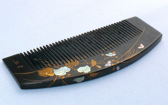 tortoise-shell hair comb with mother-of-pearl and gold inlay