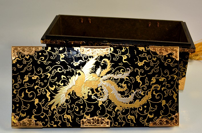 japanese wooden box with guilded image of a Bird of Paradise