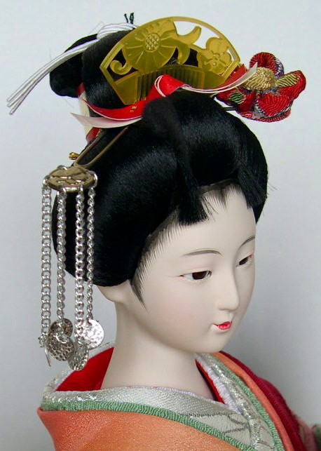 japanese doll of a Beauty with fan in her hands