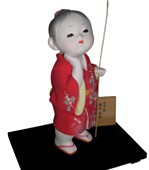 japanese hakata clay figurine of a little boy with twig