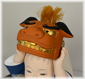 little boy with festival mask, japanese hakata doll