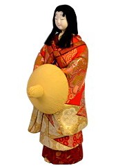 japanese kimekomi doll of a noble  lady with straw hat in her hands