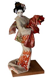 japanese traditional silk-faced doll of a dancing young lady with mask