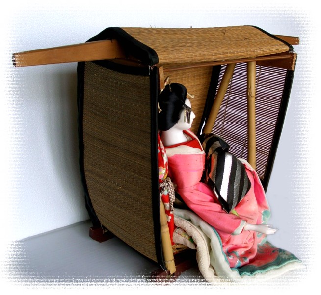 japanese antique geisha-doll in ancient taxi - kago