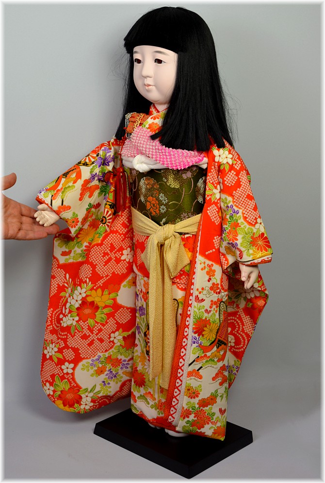 extremely large Japanese traditional doll in festive kimono