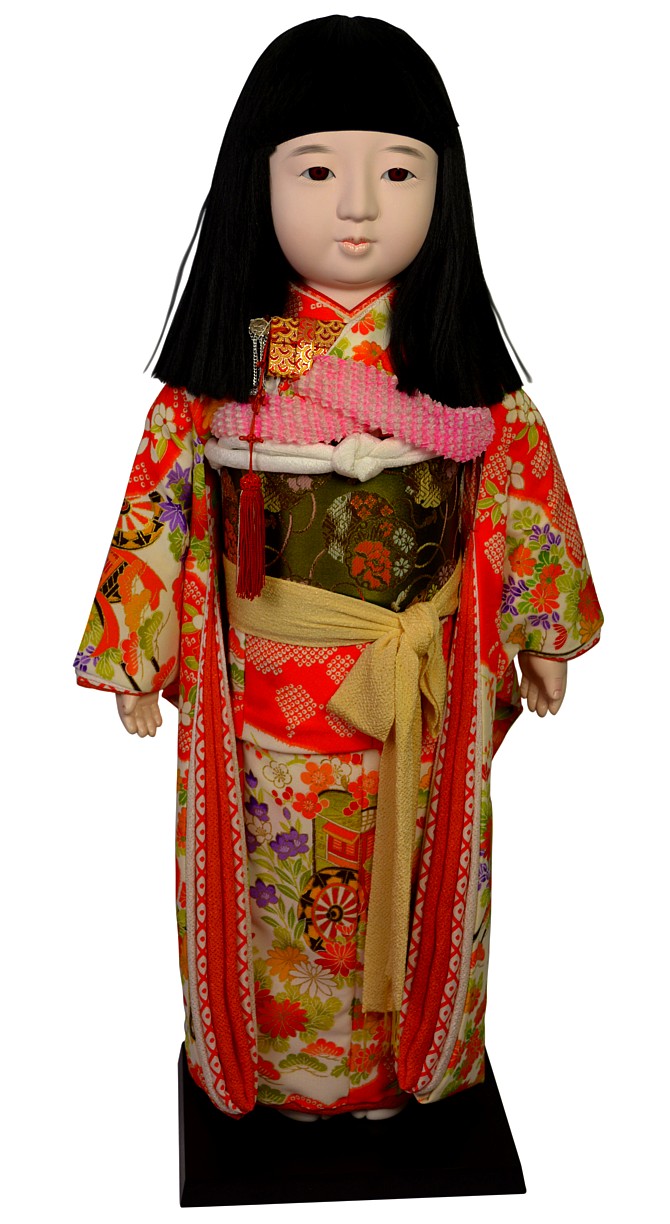 japanese antique doll of a girl in festive atire