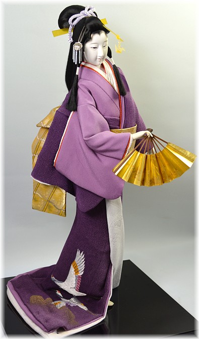 japanese doll of a dancing young woman