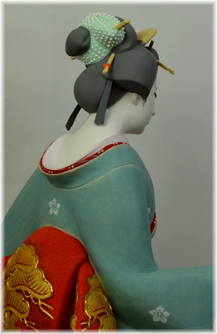 japanese hakata clay doll of a geisha with folding fan