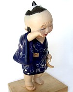 japanese hakata doll of a crying child