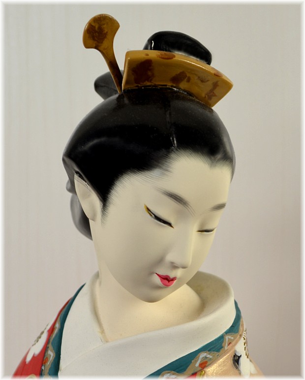 japanese clay doll of a young woman in red kimono with cherry blossom motif, 1980's