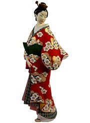japanese hakata doll of a young lady in red kimono and green obi belt