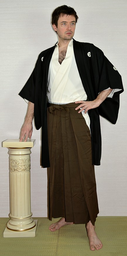 japanese man's traditional outfit: silk haori jacket, hakama pants, kimono